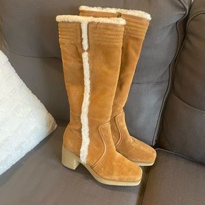 Brand new (no tags) Cole Haan suede and leather boots lined with fur.